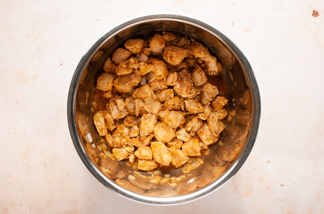 Recipe step - chicken cubes in instant pot.