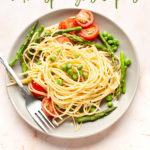 Pasta primavera with asparagus and peas in a plate.
