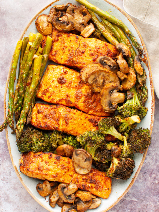 Air fryer salmon and vegetables in a platter.