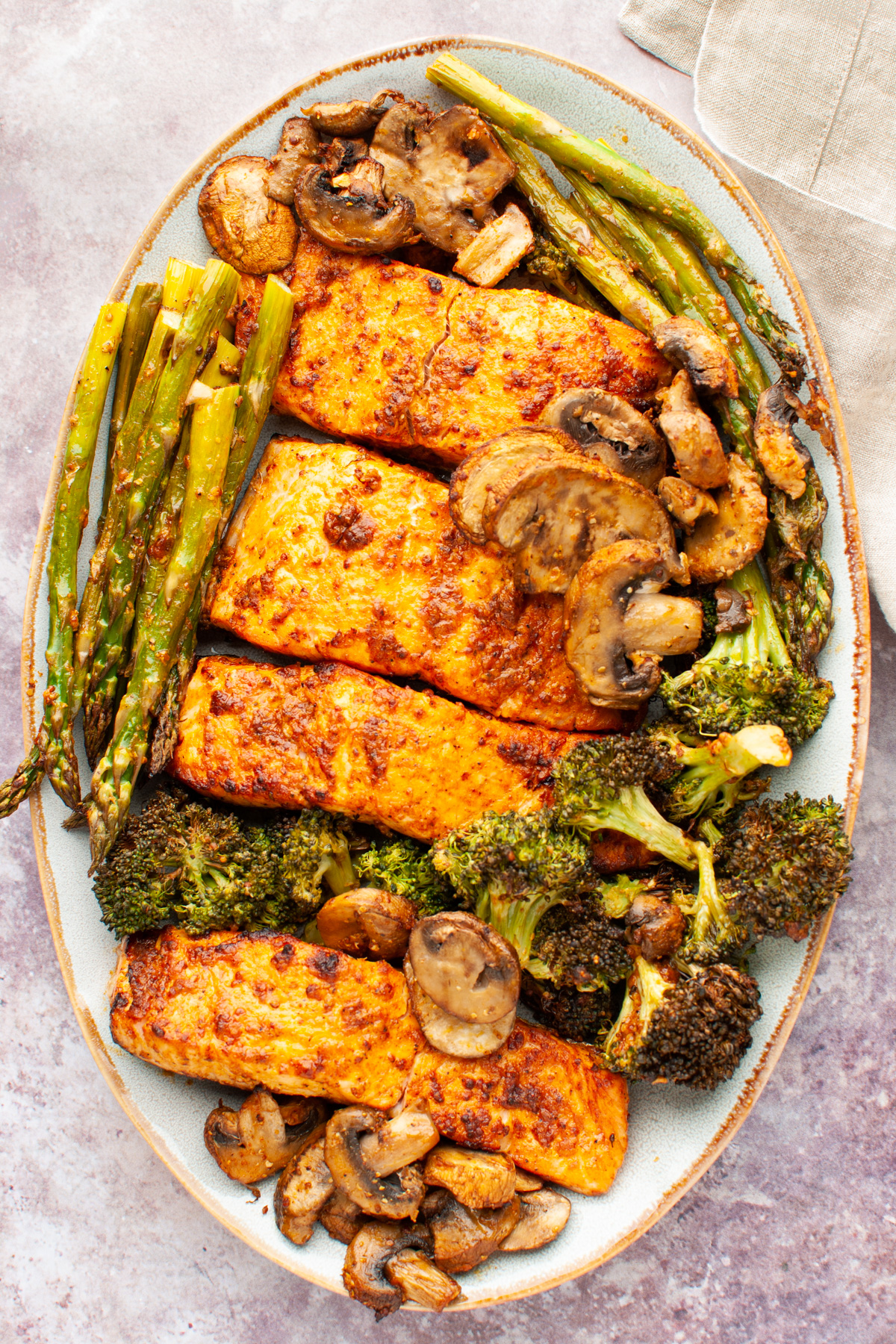 Air fryer salmon and vegetables on a platter.