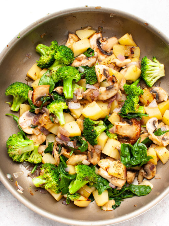 Sautéed vegetables in a frying pan.