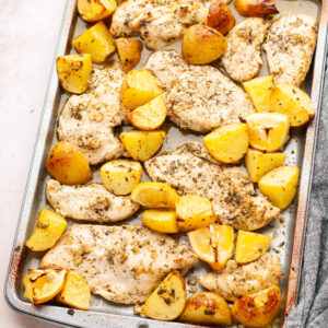 Lemon chicken and potatoes on a sheet pan.