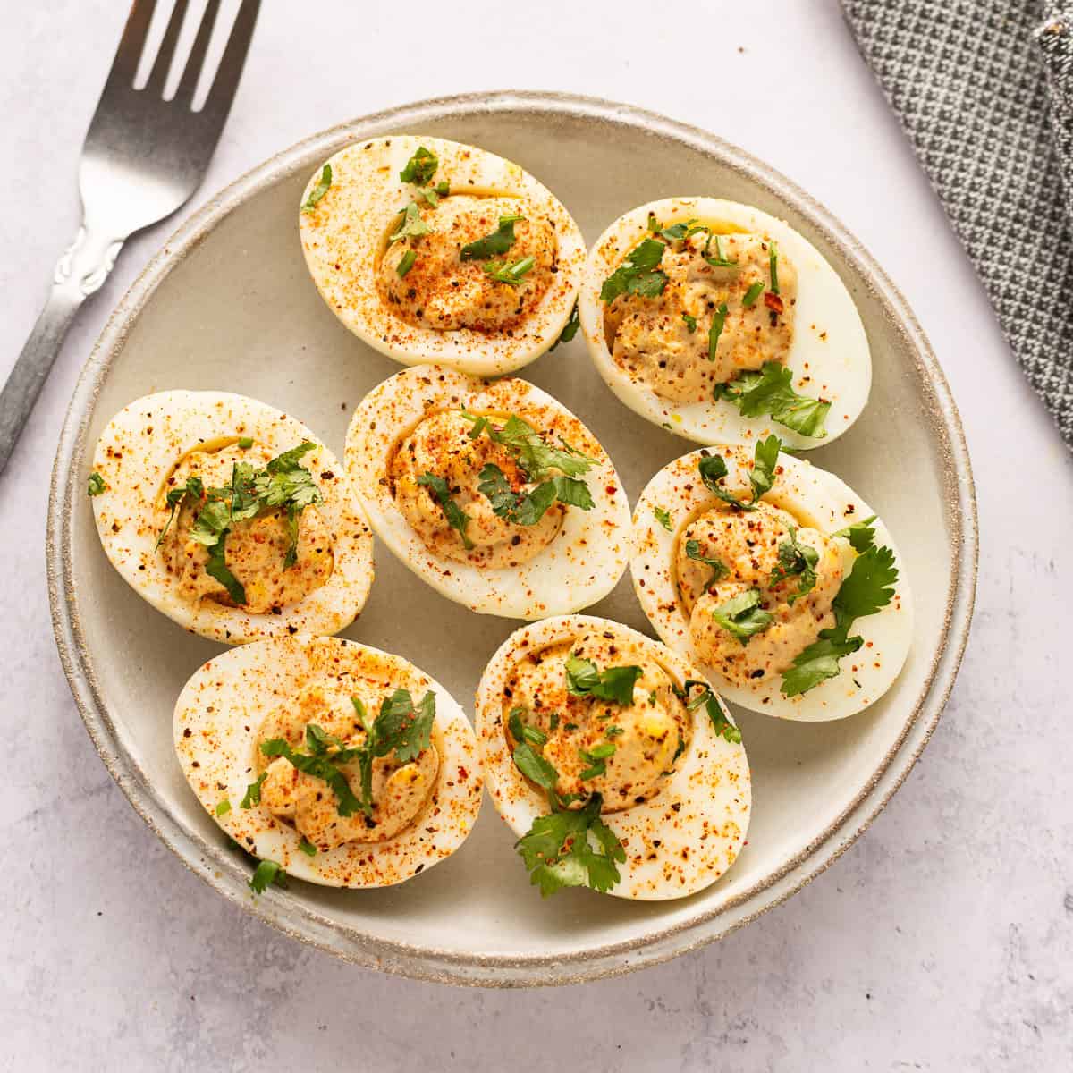 Mexican deviled eggs on a plate.