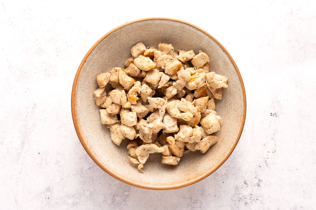 Diced, pan-fried boneless chicken in a bowl.