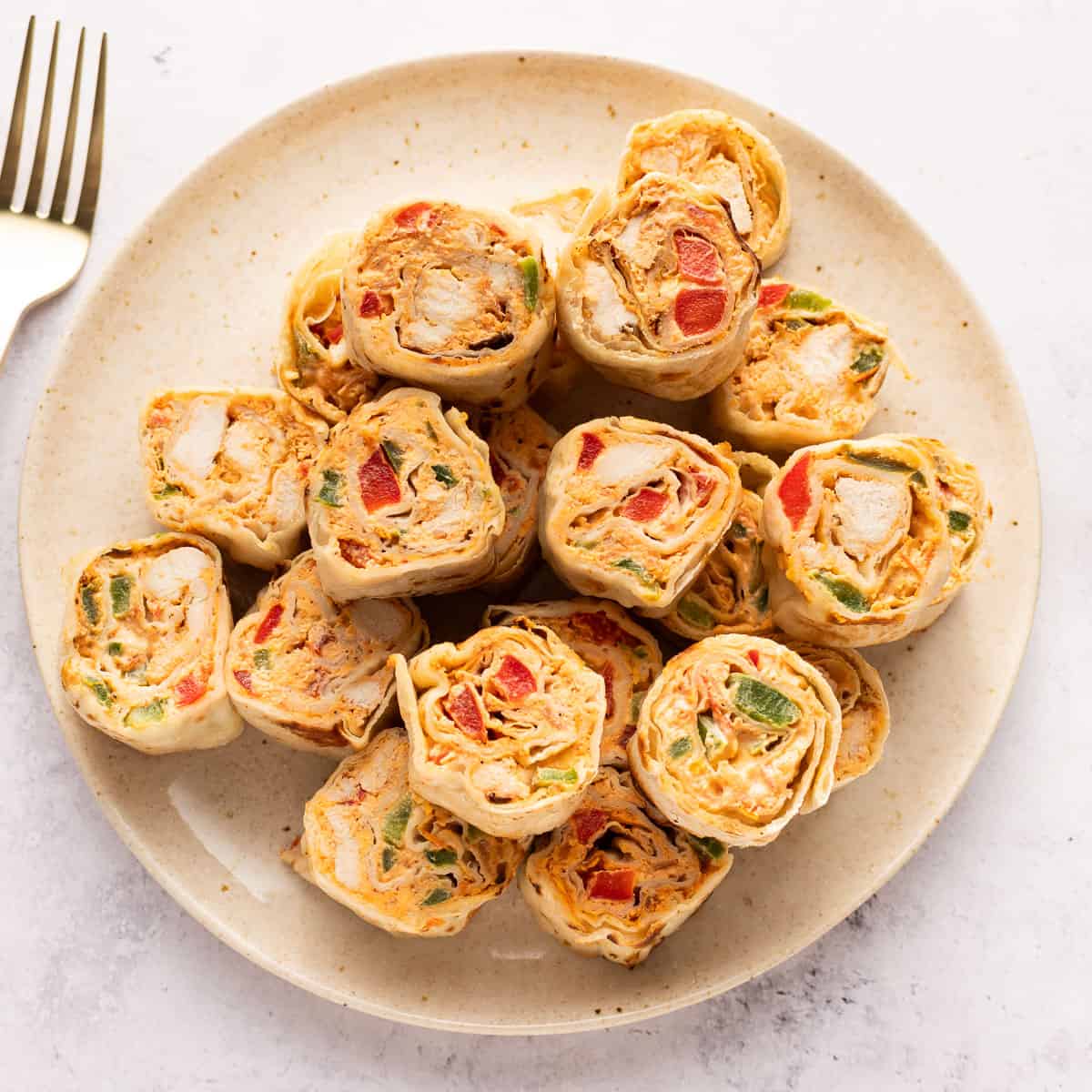 Mexican chicken pinwheels in a plate.