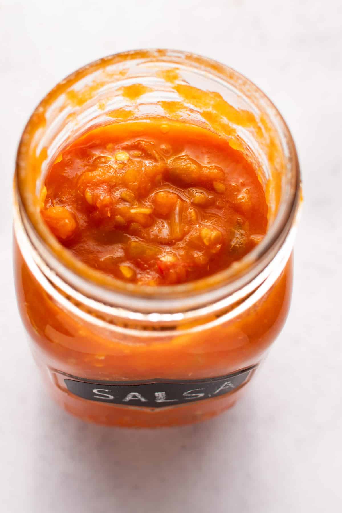 Mexican tomato salsa in a jar.