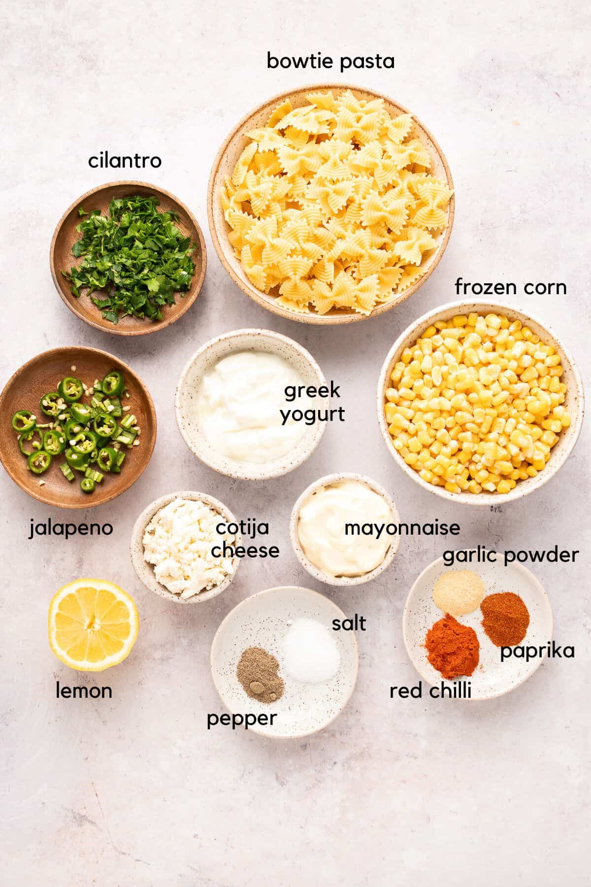 Labelled ingredients for elote pasta salad.